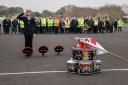 Trainee Engineering Technician Marine Engineering William Lamont lays a wreath.