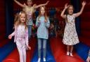 Youngsters have fun on a bouncy castle