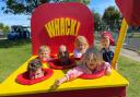 A family have fun at an arcade game at the Summer on the Mag jubilee celebrations in Gorleston