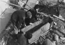 Workmen removing a stone coffin from the Blackfriars site. Picture: Percy Trett Collection/Time and Tide Museum