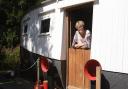 Sally Bransom with her 1893 lifeboat which she has converted into a holiday home in Horsford.