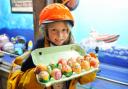 Caister Lifeboat holding a Easter Egg hunt over the bank holiday weekend. Scouts, guides and local school children have handmade the eggs for the visitors to find.Hannah King (dressed as a crew member) on holiday with her family holding some eggs