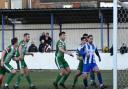 Adam Tann (centre) equalises for Gorleston on his debut.