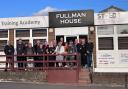 Staff from East Coast College and St Eds outside the training academy in Norwich.