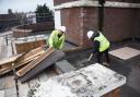 Andy Goddard, site foreman, and Jack Isbell, assistant contracts manager for Stroods working on the roof of the Iron Duke in Great Yarmouth.