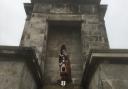 A piper plays on the steps of Nelson's memorial in Great Yarmouth to commemorate VJ Day.