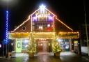 Caister village hall illuminated for Christmas.