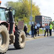 Animal rights activists stopping farmers\' vehicles at an earlier protest at Norwich Livestock Market