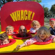 A family have fun at an arcade game at the Summer on the Mag jubilee celebrations in Gorleston