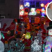 Michael Naylor and daughter Danielle Wood, alongside their incredible collection of Christmas lights and inflatables