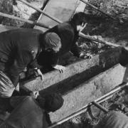 Workmen removing a stone coffin from the Blackfriars site. Picture: Percy Trett Collection/Time and Tide Museum