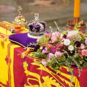 The coffin of Queen Elizabeth II, draped in the Royal Standard