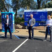 Sir Brandon Lewis (centre) cut the ribbon at the opening of new 'ultra-rapid' Ev charging point at Gapton Hall Retail Park. Picture - James Weeds