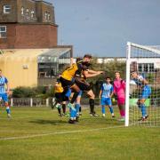 Sam Adams heads home Yarmouth's 4th goal against Holbeach on Saturday.