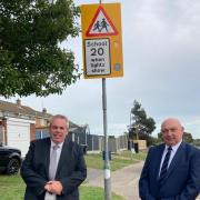 County Councillors Carl Smith and Carl Annison at one of the new 20mph signs in Bradwell.