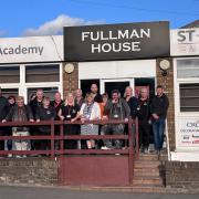 Staff from East Coast College and St Eds outside the training academy in Norwich.