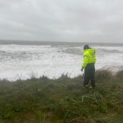 Hemsby Independent Lifeboat coxswain Daniel Hurd investigating damage to the dunes in Hemsby. Picture - James Weeds