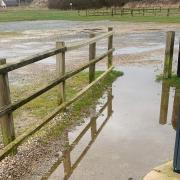 A puddle in front of a parking meter at Clink Road carpark in Sea Palling.