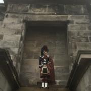 A piper plays on the steps of Nelson's memorial in Great Yarmouth to commemorate VJ Day.