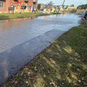 Newport Road in Hemsby pictured flooded after a water main burst