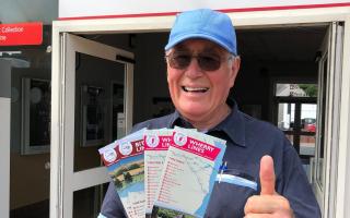 Trevor Garrod, chair of the East Suffolk Travel Association, gives the new timetables the thumbs up.