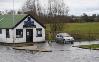 Flood warnings are in place in parts of Norfolk due to high tides and stormy weather conditions.